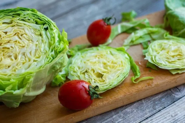 Cabbage on a cutting board. Photo by Pexels