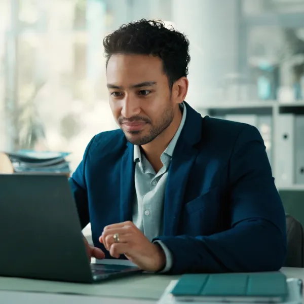 gen z businessman working on laptop wants a shorter workweek