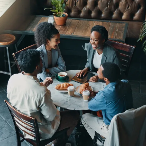 friends enjoying meal at a restaurant with phone ban