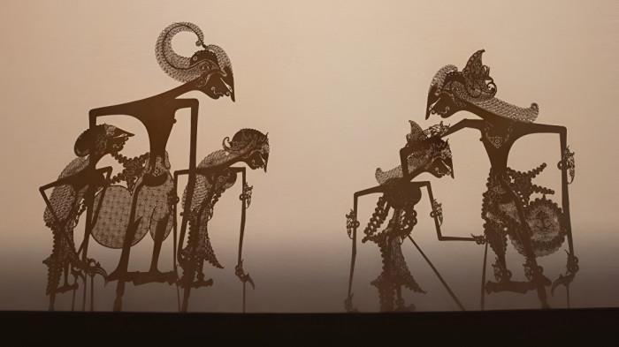 WAYANG KULIT- Ilustrasi pertunjukan wayang kulit dalam kesenian Jawa.