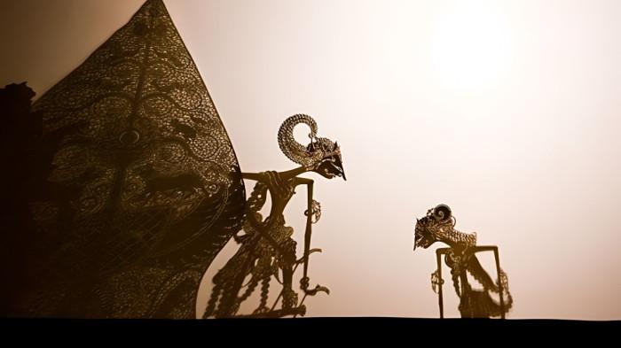 WAYANG KULIT- Ilustrasi sebuah penampilan kesenian wayang kulit yang merupakan tradisi peninggalan masyarakat Jawa.