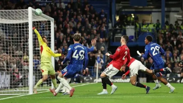 LONDON, ENGLAND - APRIL 18: Senne Lammens of Manchester United makes a save during the Premier League match between Chelsea and Manchester United at Stamford Bridge on April 18, 2026 in London, England. (Photo by Chelsea Football Club/Chelsea FC via Getty Images)