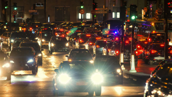 Cars navigating traffic with help from green wave traffic lights