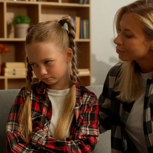 mom talking to upset daughter