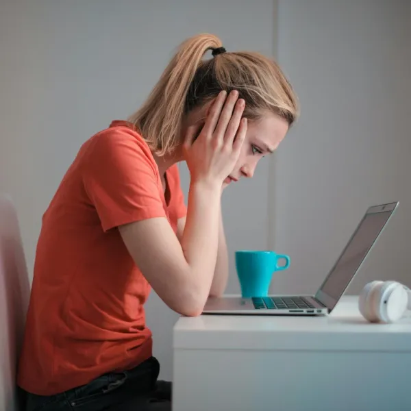 woman who doesn't vacation often enough to recover from work