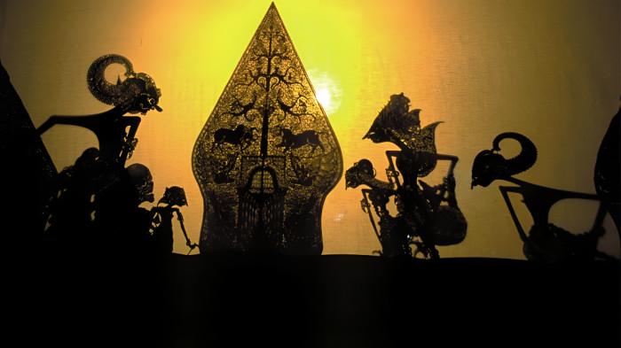 WAYANG KULIT- Ilustrasi kesenian wayang kulit yang merupakan bagian dari tradisi masyarakat Jawa.