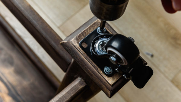 Screwing a caster to a table