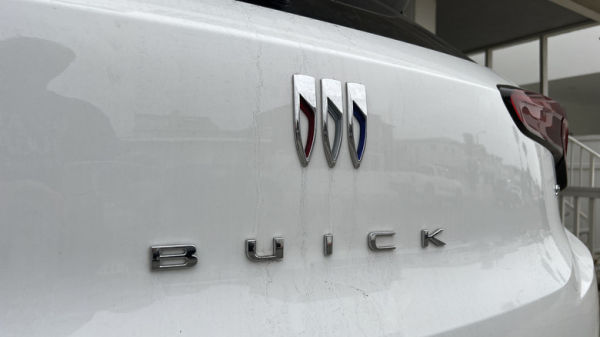 Close-up of the Buick logo on the back of a white vehicle