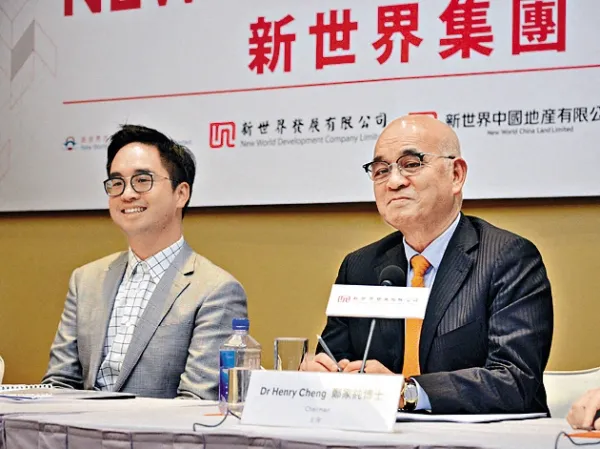 Henry Cheng Kar-shun, right, chairman of family flagships Chow Tai Fook Jewellery Group and New World Development, and his son Adrian Cheng Chi-kong attend a press conference in Hong Kong, China, Sep. 21, 2016. Photo by Imaginechina via AFP