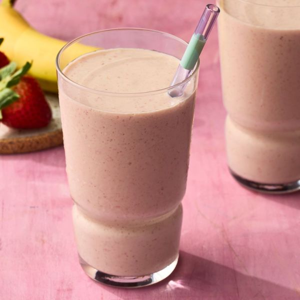 A recipe image of Strawberry–Passion Fruit Smoothie. Credit: Photographer: Greg Dupree, Prop Stylist: Claire Spollen, Food Stylist: Chelsea Zimmer