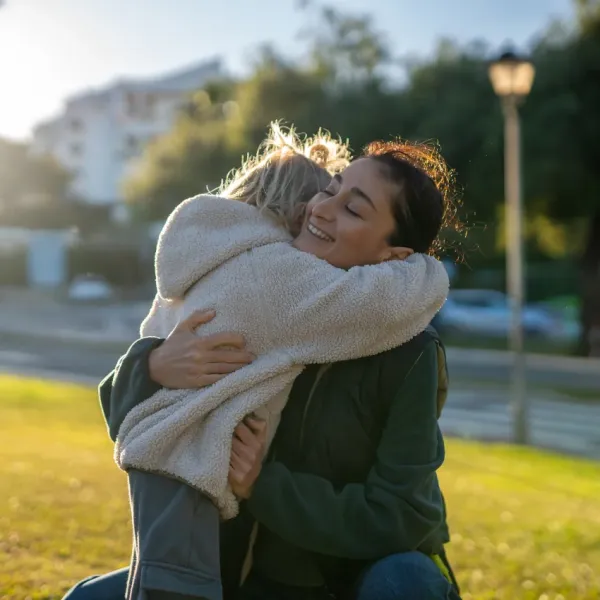 mom showing her child unconditional love with a huge hug