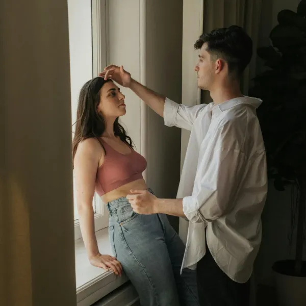 tall man noticing how short a woman is