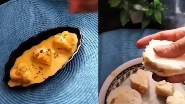 Heart-shaped sandwich bread pieces soaked in creamy mango milk rabri, garnished with chopped nuts for a quick dessert.