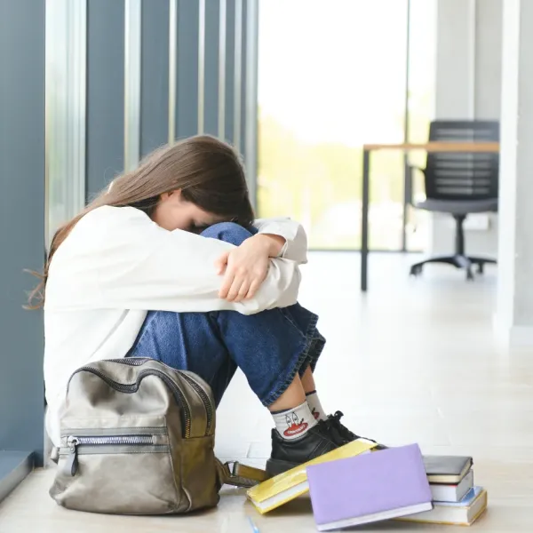 teen girl being bullied in high school