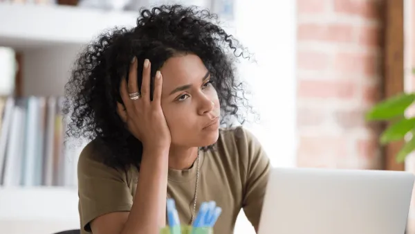 Woman at work zoning out 