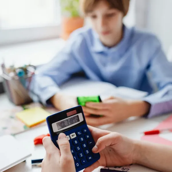 parent teaching their son about money