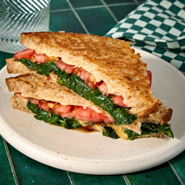 An image recipe of Grilled Cheese with Spinach & Tomato. Credit: Photographer: Jen Causey, Food Stylist: Julian Hensarling, Prop Stylist: Claire Spollen.
