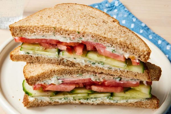 a recipe photo of the Cucumber & Tomato Sandwich Credit: Photographer: Stacy k. Allen, Props: Christina Brockman, Food Stylist: Jennifer Wendorf