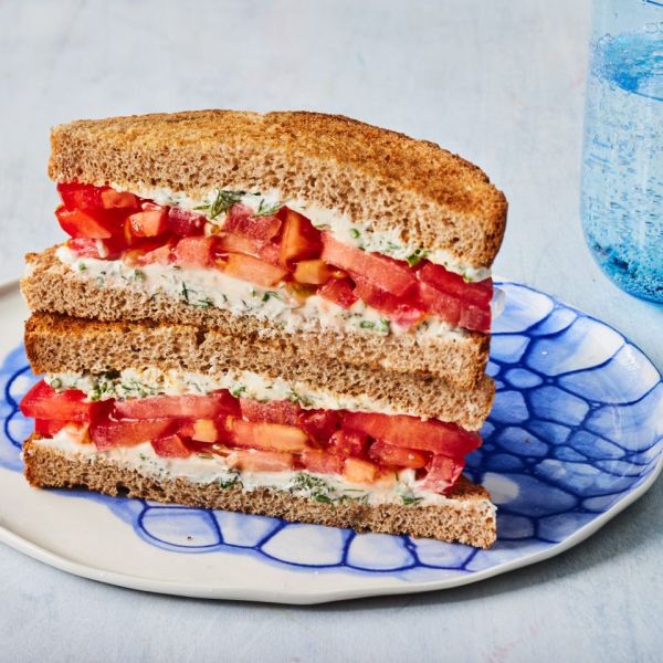 a recipe photo of the Tomato Sandwich Credit: Photographer: Greg DuPree, Food Stylist: Anna Kelly, Prop Stylist: Christina Brockman