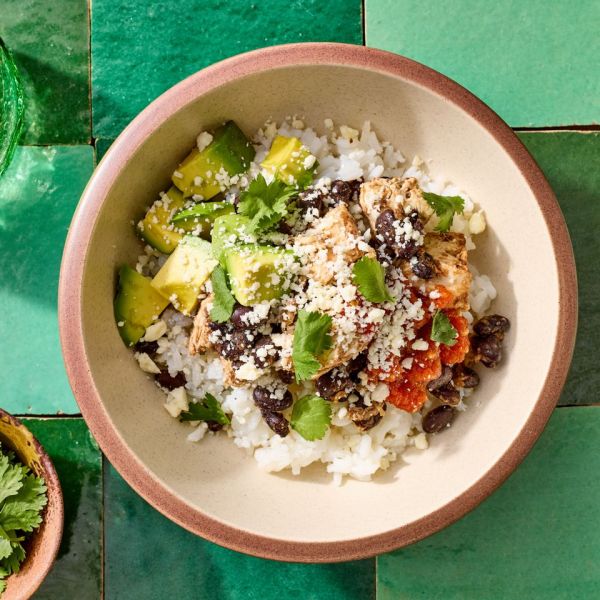 A recipe image of Black Bean, Chicken & Rice Bowl. Credit: Photographer: Jake Sternquist, Food Stylist: Shannon Goforth. Prop Stylist: Breanna Ghazali.