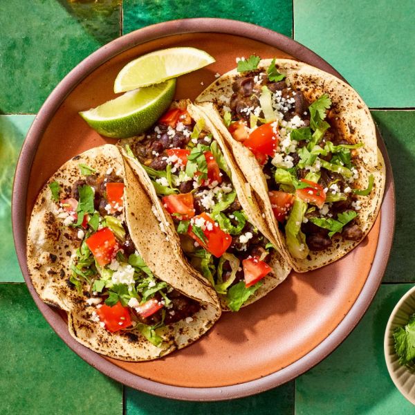 A recipe image of Black Bean Tacos. Credit: Photographer: Jake Sternquist, Food Stylist: Shannon Goforth. Prop Stylist: Breanna Ghazali.