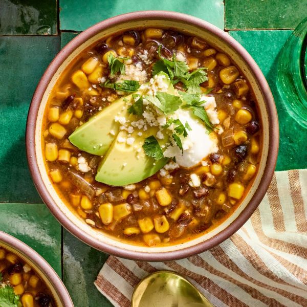 A recipe image of Black Bean & Corn Soup Credit: Photographer: Jake Sternquist, Food Stylist: Shannon Goforth. Prop Stylist: Breanna Ghazali.