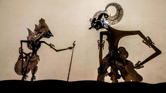 WAYANG KULIT- Ilustrasi pertunjukan kesenian wayang kulit yang merupakan bagian dari tradisi masyarakat Jawa.