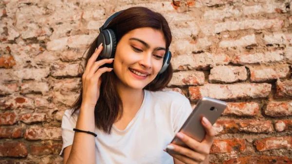 young woman listening music woman listening to spotify music