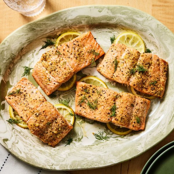Recipe image of Baked Lemon-Pepper Salmon. Credit: Photographer: Morgan Hunt Ward, Prop Stylist: Phoebe Hauser, Food Stylist: Emily Nabors Hall.