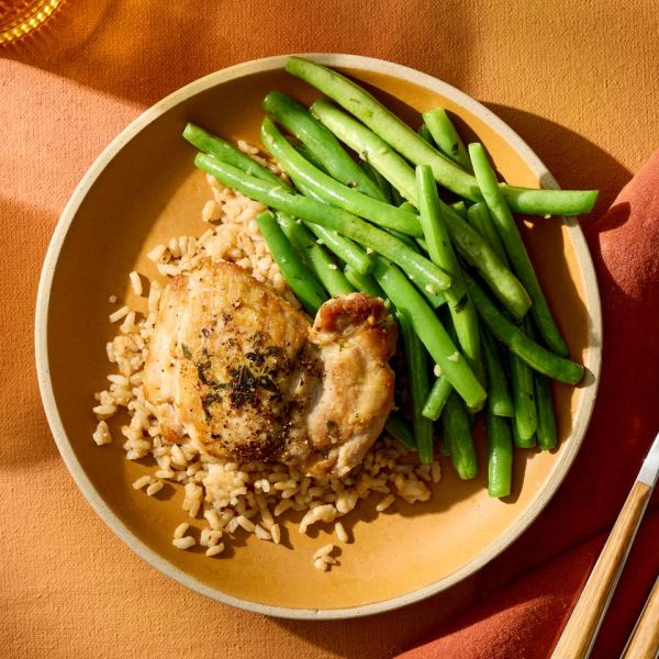 a recipe photo of Garlic & Thyme Chicken with Green Beans & Rice Credit: Photographer: Jake Sternquist, Food Stylist: Sammy Mila, Prop Stylist: Gabriel Greco.