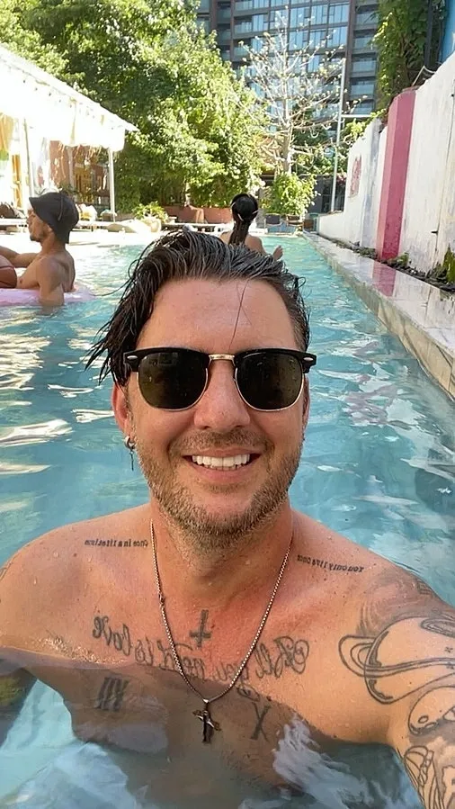 Carl Tomich in a swimming pool in Hanoi to cool down the heat, May 26 2026. Photo courtesy of Carl Tomich