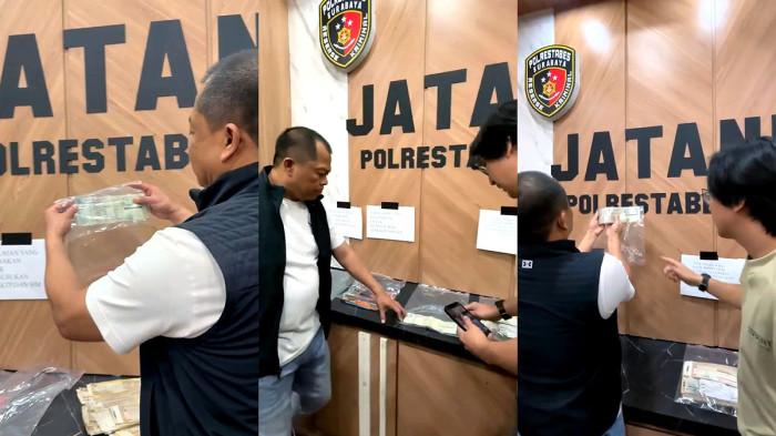 BARANG BUKTI - Kapolrestabes Surabaya, Kombes Pol Luthfie Sulistiawan, mengecek satu per satu STNK asli tapi palsu di Mapolrestabes Surabaya, Rabu (27/5/2026), polisi berhasil mengungkap kasus sindikat pemalsu STNK kendaraan sepeda motor dan mobil.