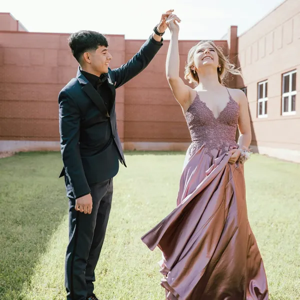 two teenagers going to prom together 