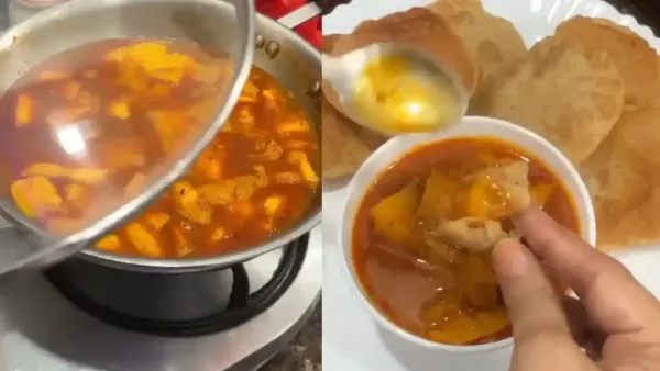 Traditional aam ki khatti meethi sabzi simmering in a steel pan and served with fluffy golden pooris.
