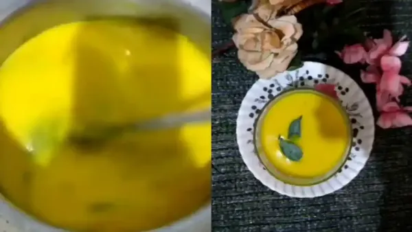 Vibrant yellow mango fajito curry being stirred in a pot and served in a bowl garnished with leaves.