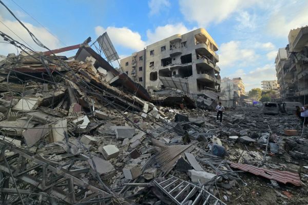 People gather at the site of an Israeli strike that hit near a hospital in Tyre, Lebanon, on June 1.