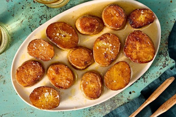 A recipe image of Salt-&-Vinegar Melting Potatoes Credit: Photographer: Jen Causey.