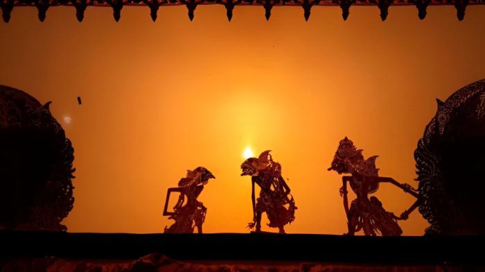 WAYANG KULIT- Ilustrasi pertunjukan kesenian wayang kulit yang merupakan peninggalan masyarakat Jawa.