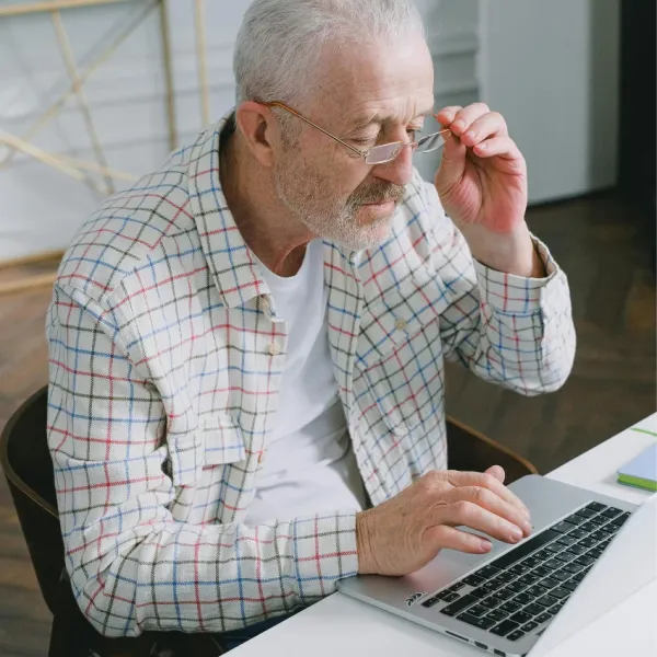 elderly man continuing to work because he can't afford to retire