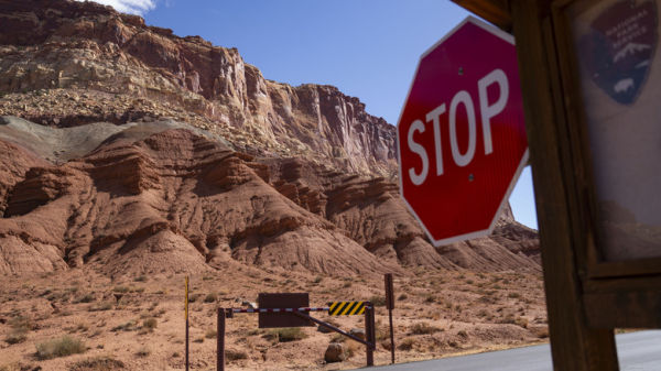 A stop sign along a mountain road.