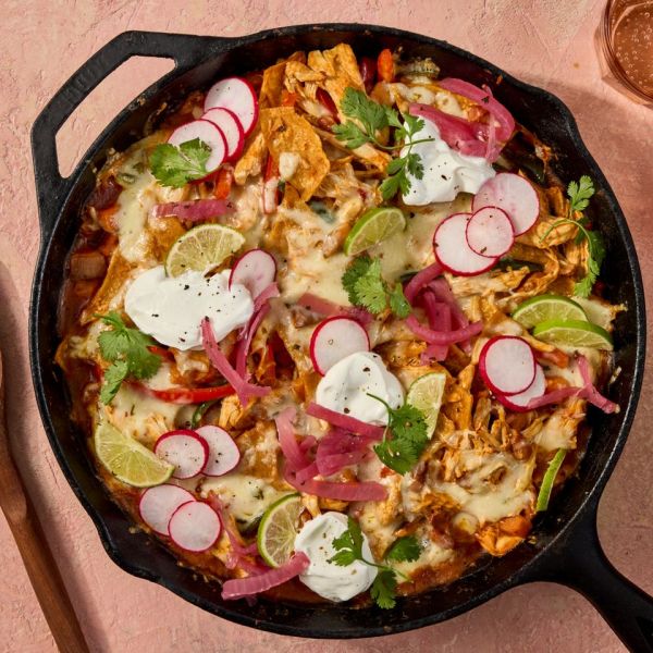 Recipe image of Chicken & Sweet Potato Enchilada Skillet Credit: Photographer: Jen Causey, Food Stylist: Margaret Monroe Dickey, Prop Stylist: Hannah Greenwood