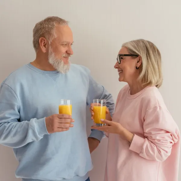 couple drinking orange juice