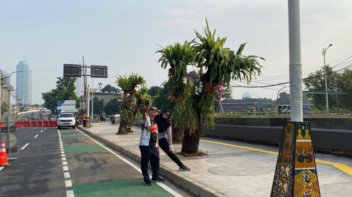 PENATAAN KOTA - Suasana Car Free Day (CFD) di Jalan HR Rasuna Said, Setiabudi, Jakarta Selatan pada Minggu (21/6/2026). Wajah baru kawasan HR Rasuna Said mendapat respons positif dari warga.