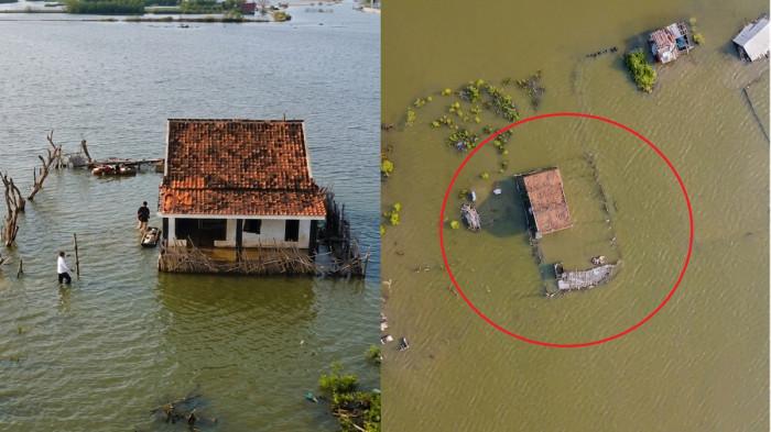 TERKEPUNG ROB - Kondisi rumah milik Siti Rokhanah yang terkepung genangan rob di Kelurahan Mbalok Kecamatan Kendal Kabupaten Kendal. Rob menggenang permukiman tersebut sejak 2006, dan perlahan merubah lahan permukiman warga menjadi tambak. 