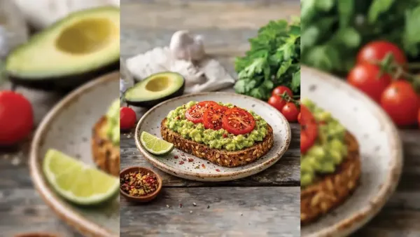 A slice of wholesome multi-seed avocado toast topped with fresh red tomato slices and chili flakes on a ceramic plate, surrounded by fresh ingredients like avocado halves, cherry tomatoes, and lime.