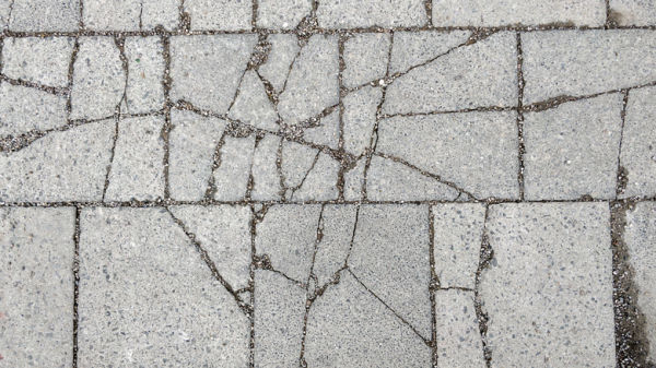 Top-down view of spalled concrete surface