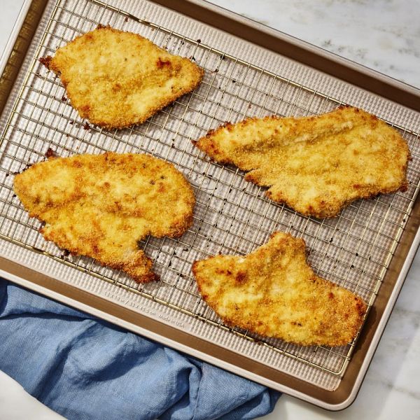 a recipe photo of the Crispy Baked Chicken Cutlets Credit: Photographer: Morgan Hunt Glaze, Prop Stylist: Lydia Pursell, Food Stylist: Emily Nabors Hall