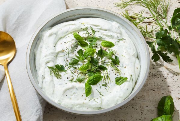 Light & airy whipped cottage cheese in a ceramic bowl, topped wiht fresh herbs Credit: Photography: Rachel Marek, Food Stylist: Annie Probst