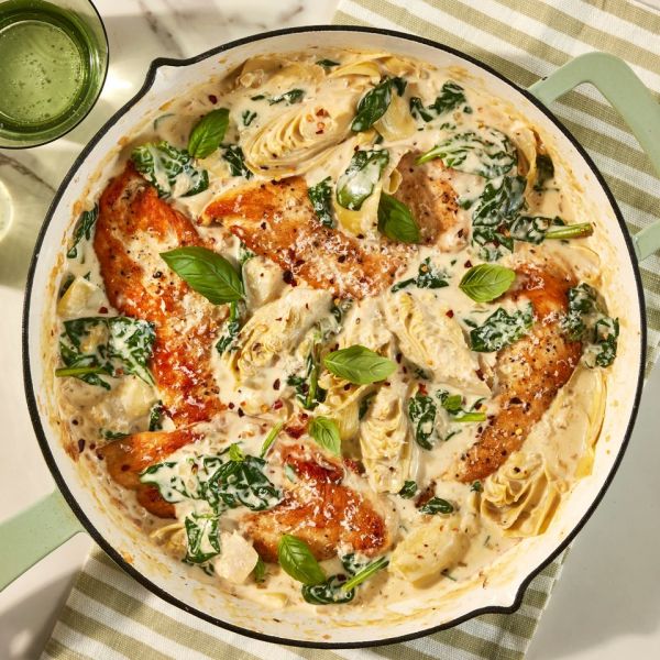 an overhead image of the Creamy Spinach and Artichoke Chicken Skillet Credit: Photographer: Jen Causey, Food Stylist: Emily Nabors Hall, Prop Stylist: Julia Bayless