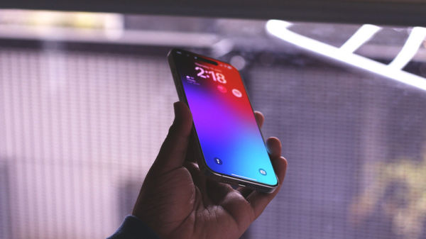 Person holding an iPhone displaying its frame